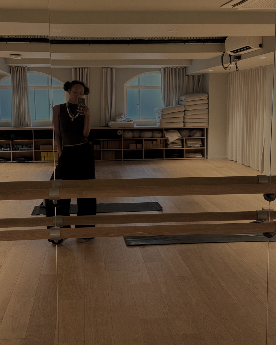 Latesha in a softly lit studio in the evening